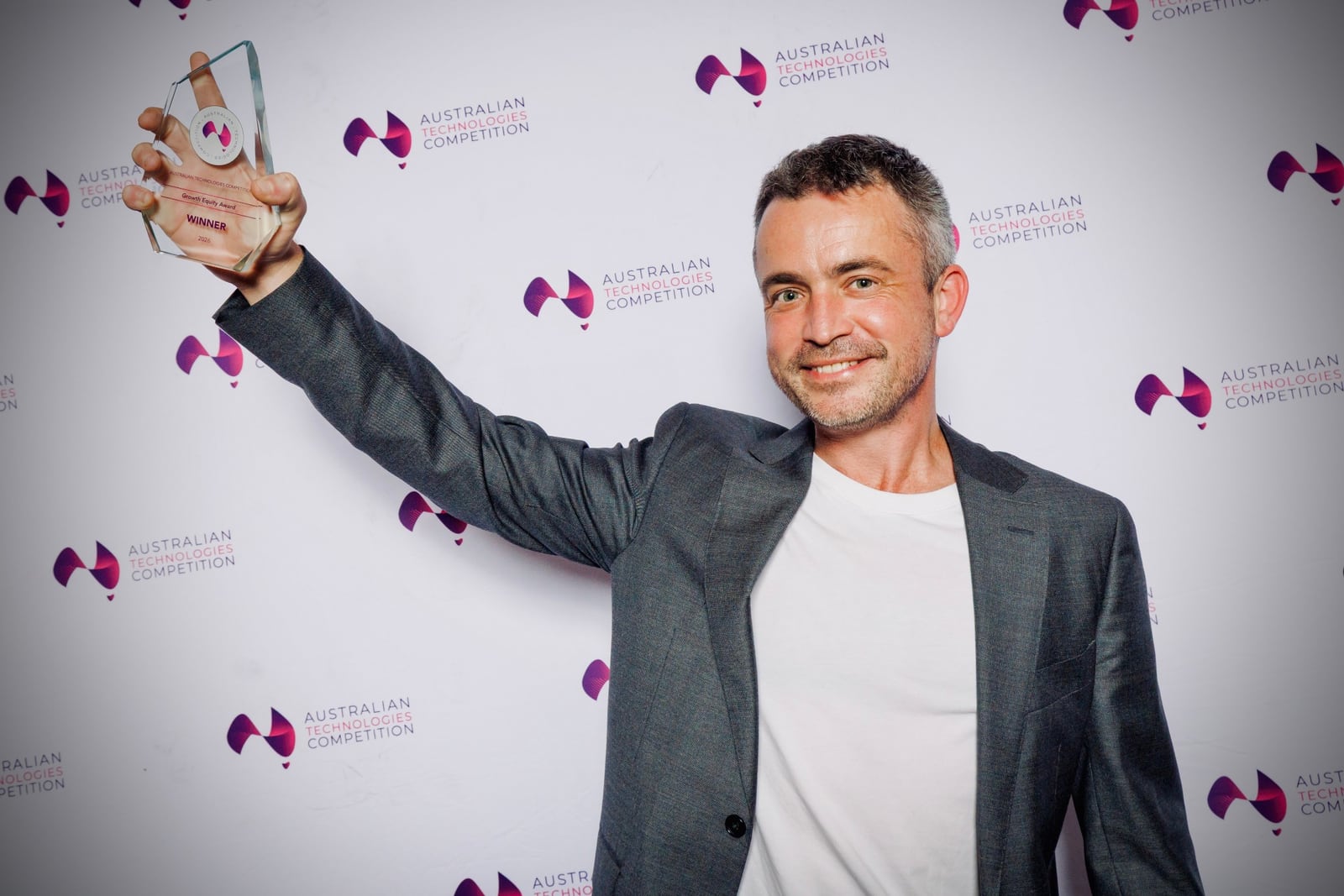 Trav Heaven holding the Growth Equity Award at the 2026 Australian Technologies Competition awards night in Sydney
